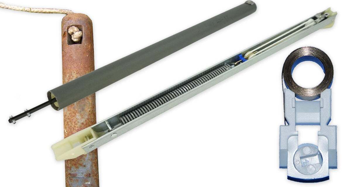 A coil balance spring assembly in a window jamb, showing a flat coil spring inside a plastic housing