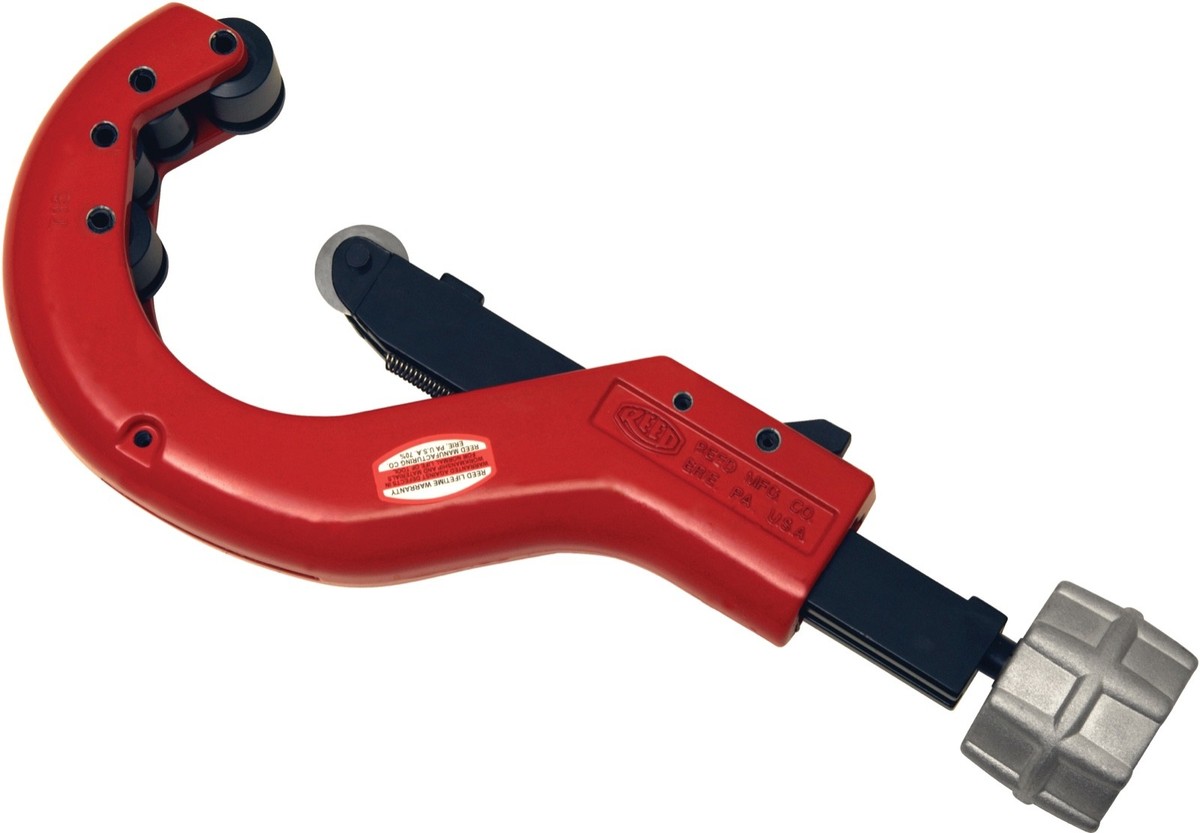 A compact copper tubing cutter clamped around a copper pipe section with the cutting wheel aligned