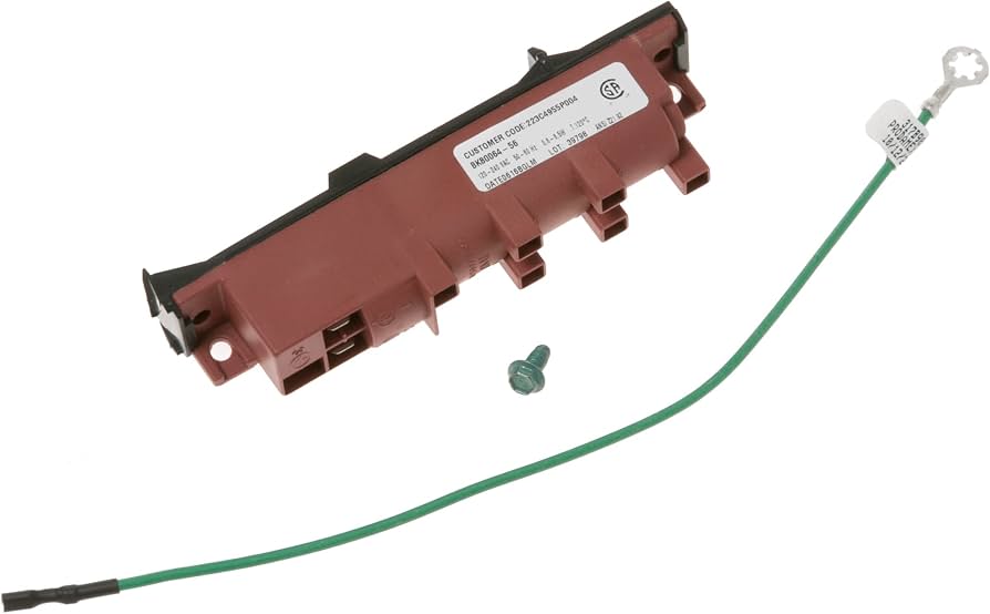 A hand holding a small rectangular gas range spark module with multiple wire terminals near an open stove back panel
