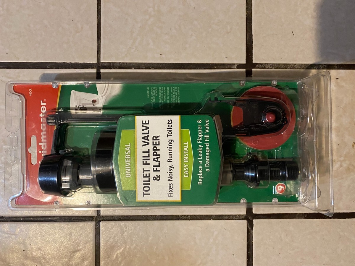 A real photo of a universal toilet flapper replacement package on a workbench next to an adjustable wrench and a towel