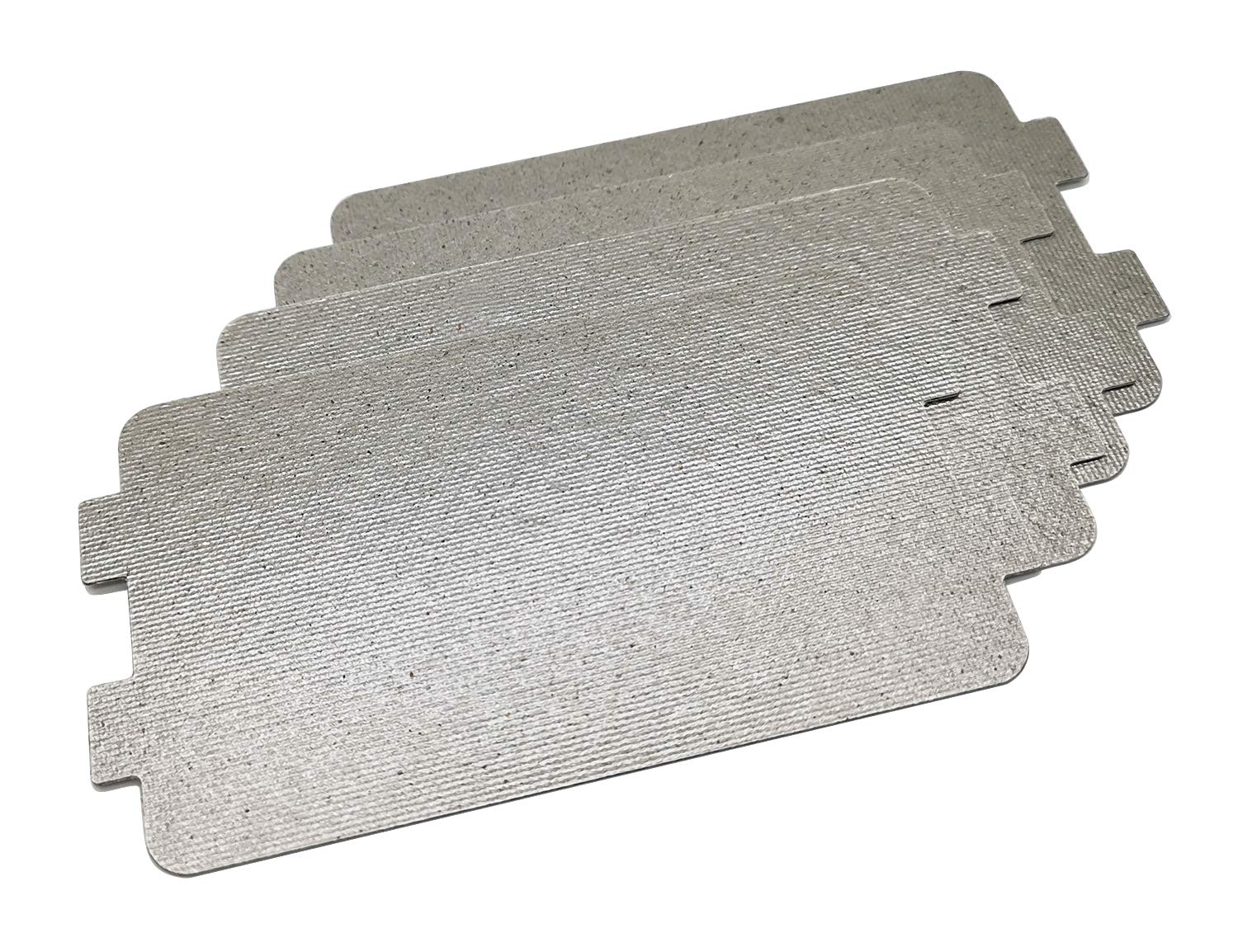 A small tan mica sheet waveguide cover lying on a workbench next to scissors and a Phillips screwdriver