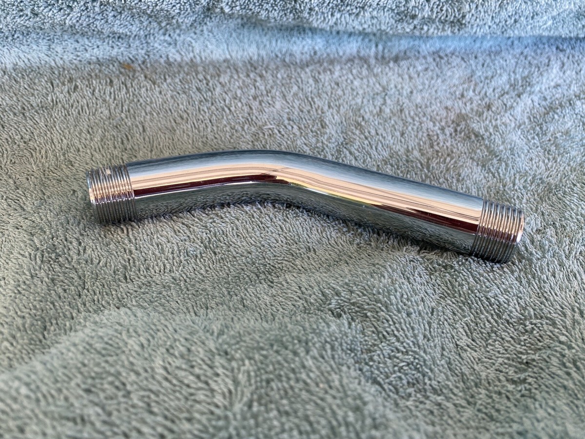 Macro close up of clean metal threads on a shower arm with no old tape remaining, ready for new thread seal tape