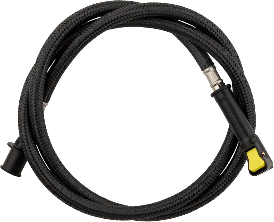 Under a kitchen sink, a pull-down faucet hose connects to a quick-connect fitting near the faucet body
